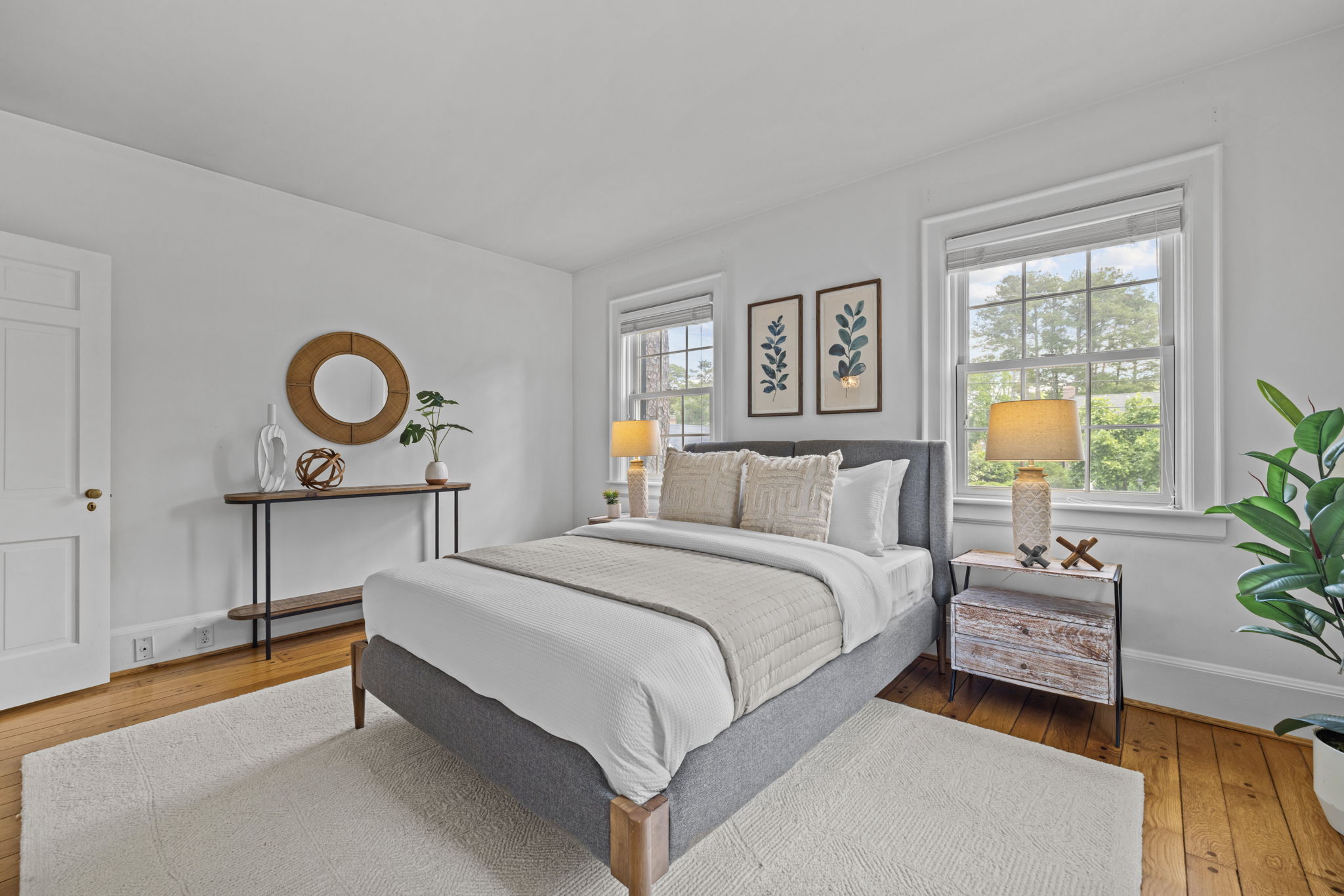 Primary bedroom with large windows